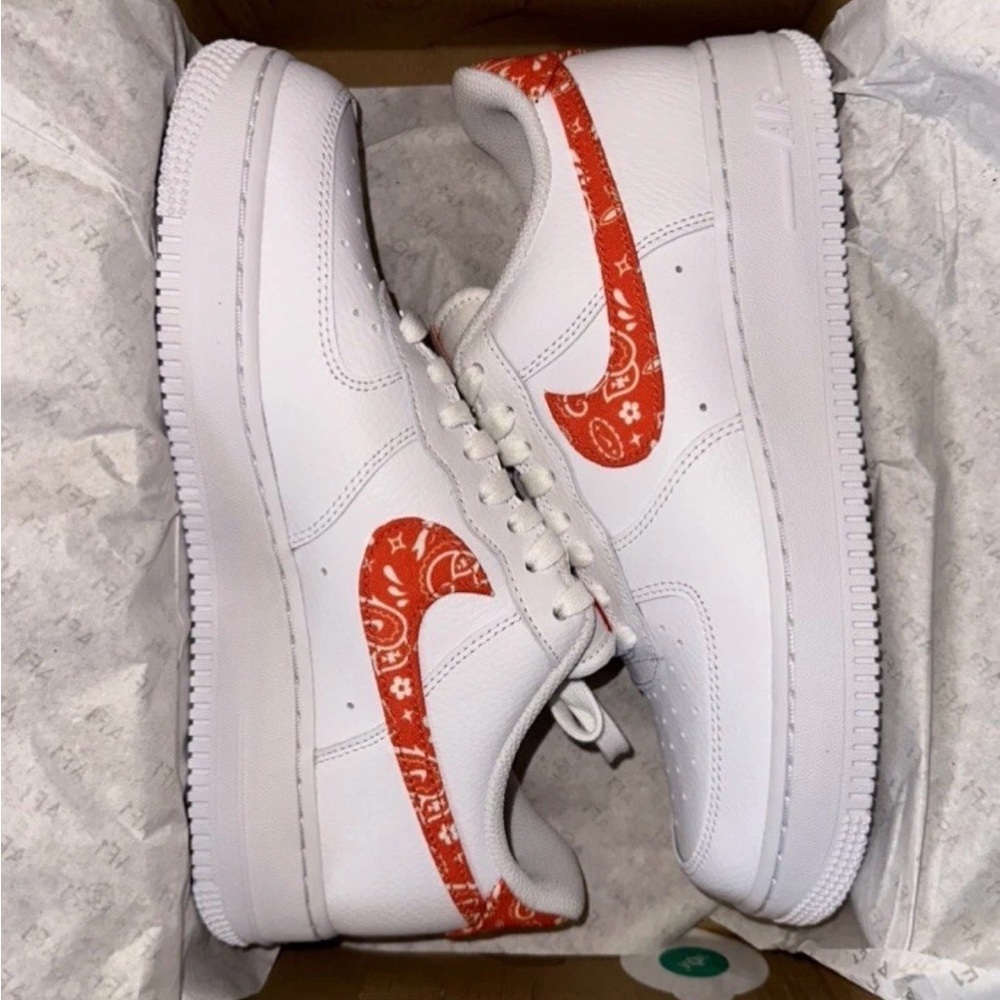 Nike White Low-Top Sneakers with Red Paisley Swoosh